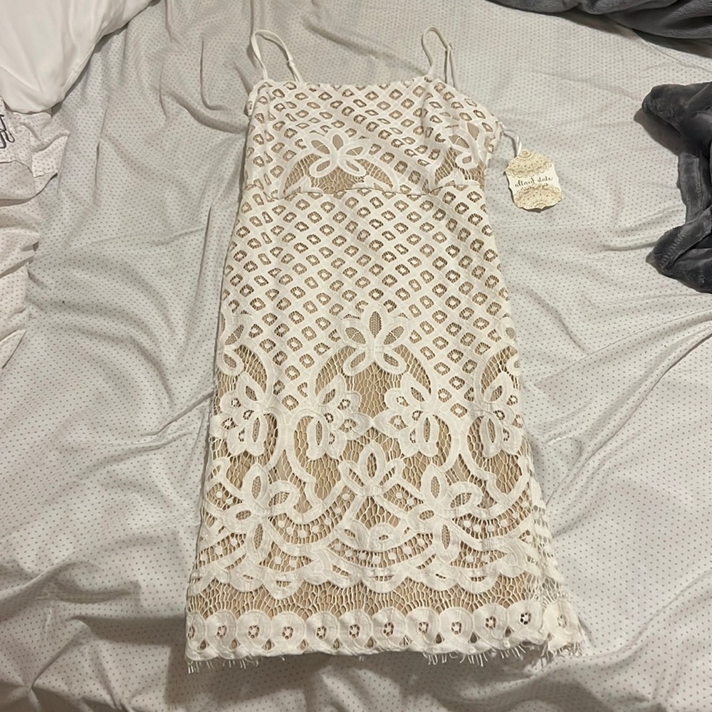 altard state dress, tight fitting up top loose on bottom, worn once